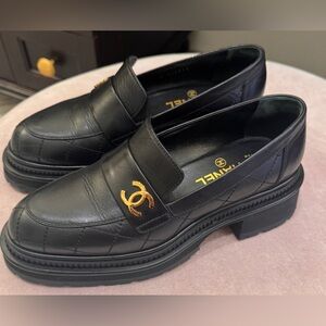 CHANEL Black Leather Loafers with Gold Accent